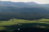 Вид с хребта Бакты примерно  на 70% территории поселения Александровка и хребет Зигальга. Июнь 2011.